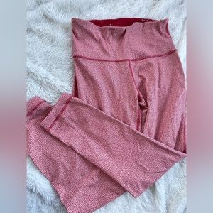 Reversible, red leggings, unknown size fits a small.